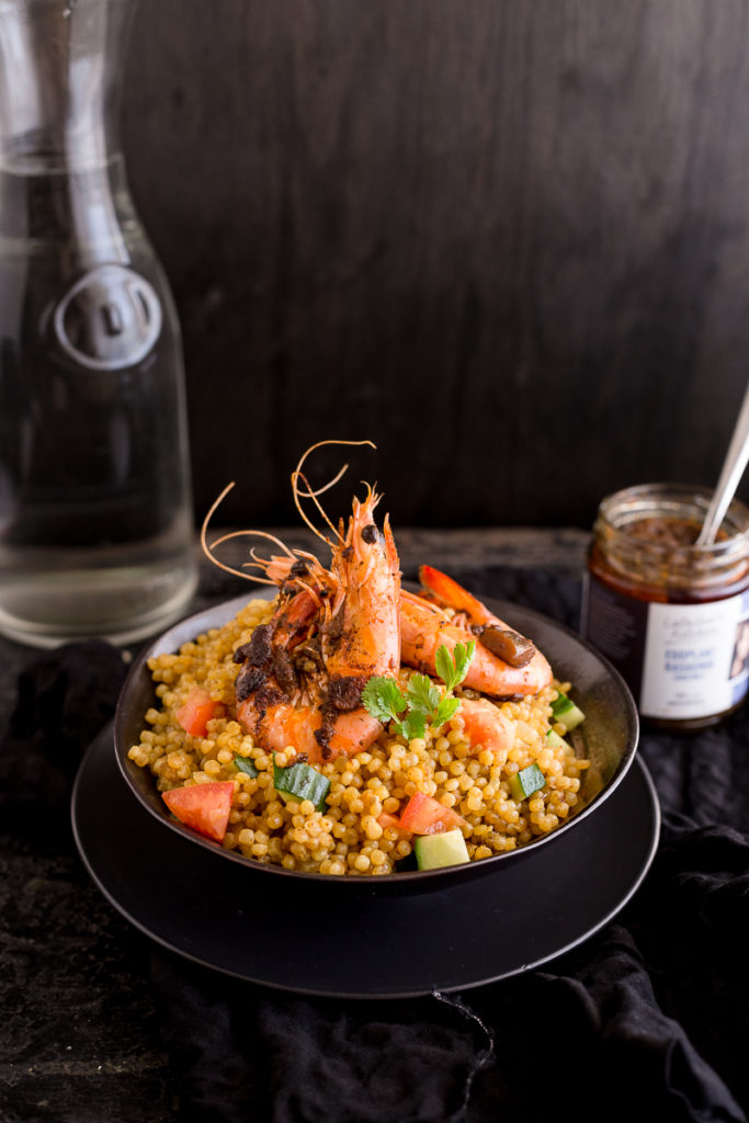 Prawns with Eggplant Kasundi Paste on a bed of cous cous